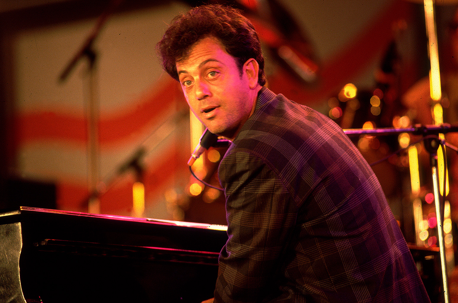 Billy Joel performs onstage during the first Farm Aid benefit concert at Memorial Stadium on Sept. 22, 1985 in Champaign, Illinois.