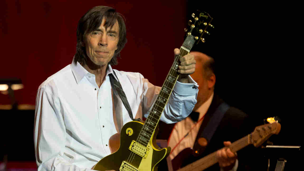 Boston’s Tom Scholz performing onstage in 2014