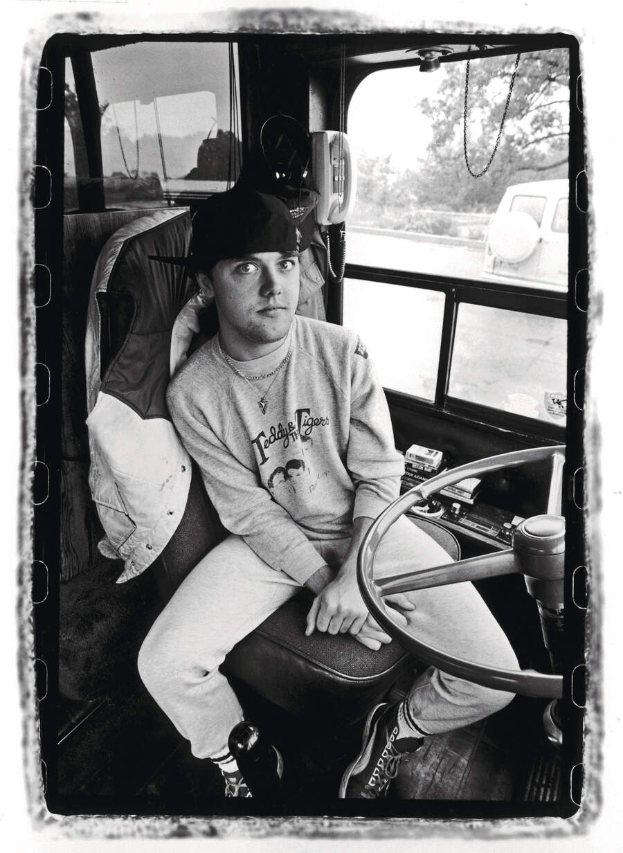Lars Ulrich in the driver's seat of a bus