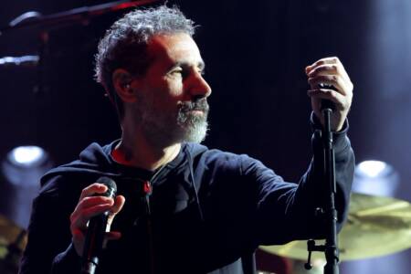 “Genocide still occurs today. We have not learned our lesson of people over profits”: Watch System Of A Down’s Serj Tankian sing heartfelt prayer for genocide victims at Sick New World festival last weekend