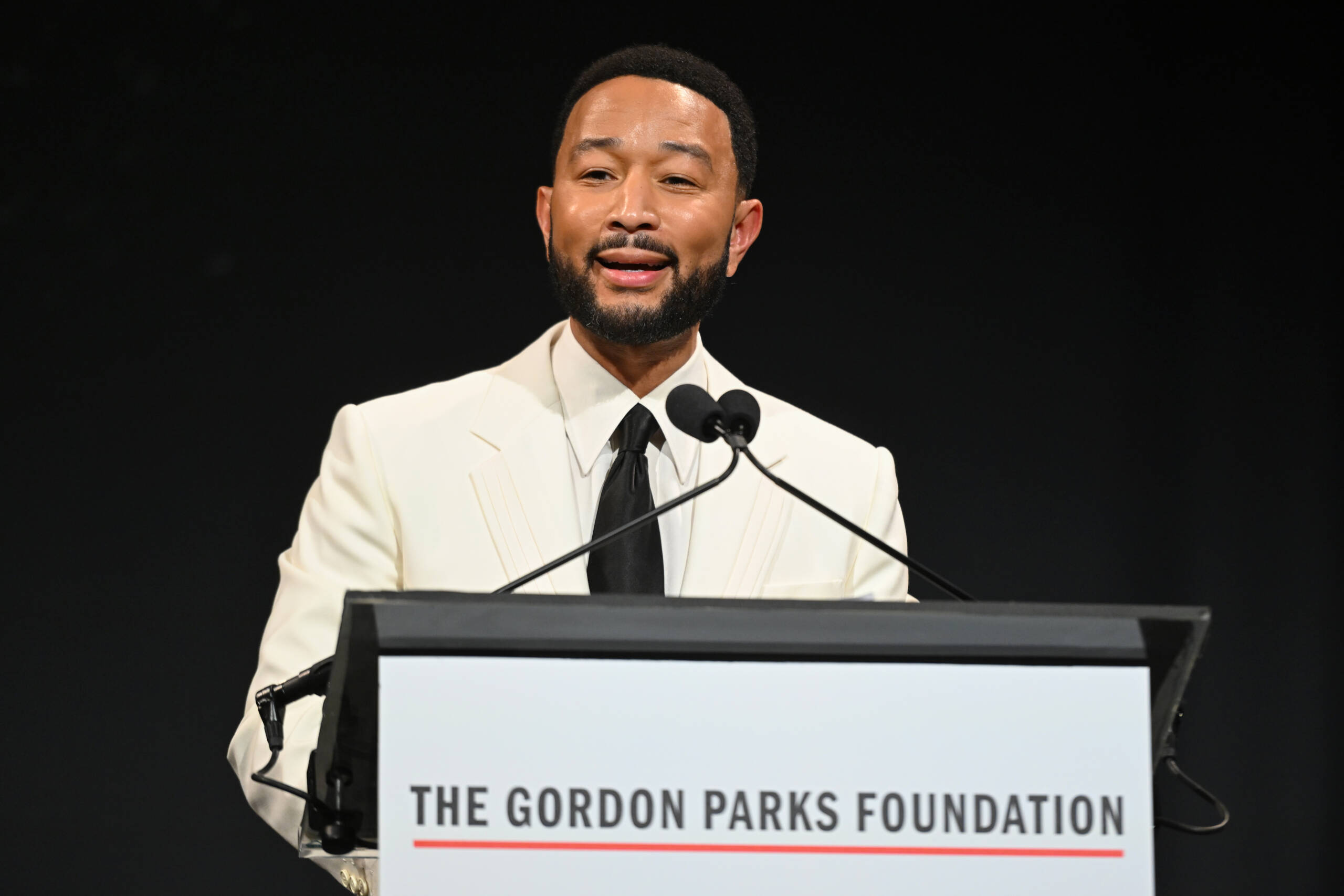 NEW YORK, NEW YORK - MAY 19: John Legend speaks onstage during The Gordon Parks Foundation Awards Dinner and Auction 2026 at Cipriani 42nd Street on May 19, 2026 in New York City.  (Photo by Noam Galai/Getty Images for The Gordon Parks Foundation   )