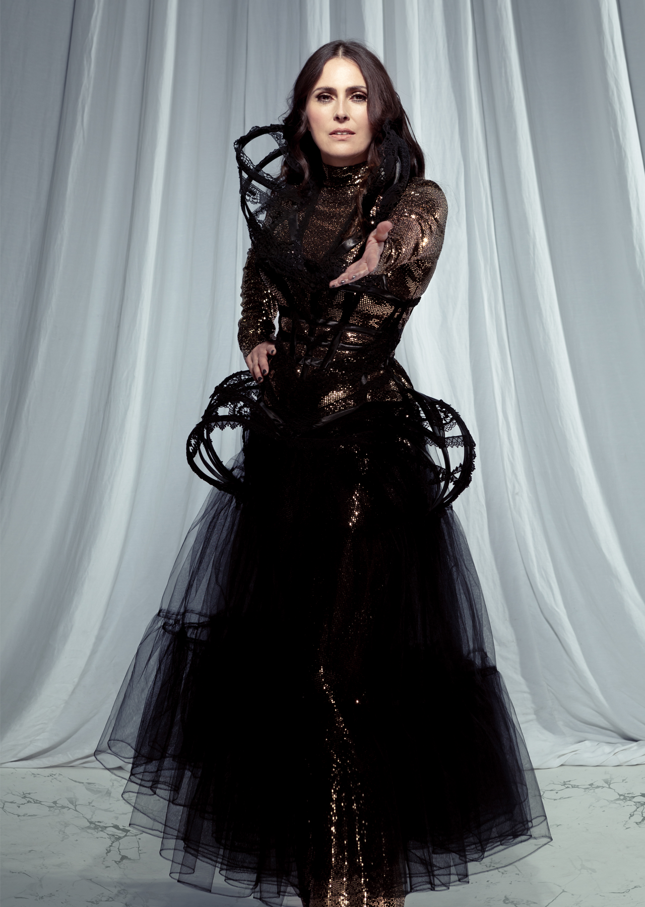 Sharon den Adel in a black dress