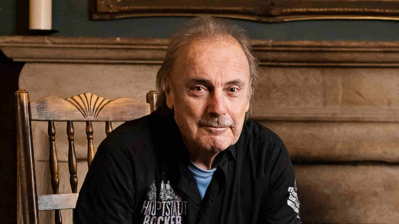 Former Status Quo drummer John Coghlan posing for a photograph