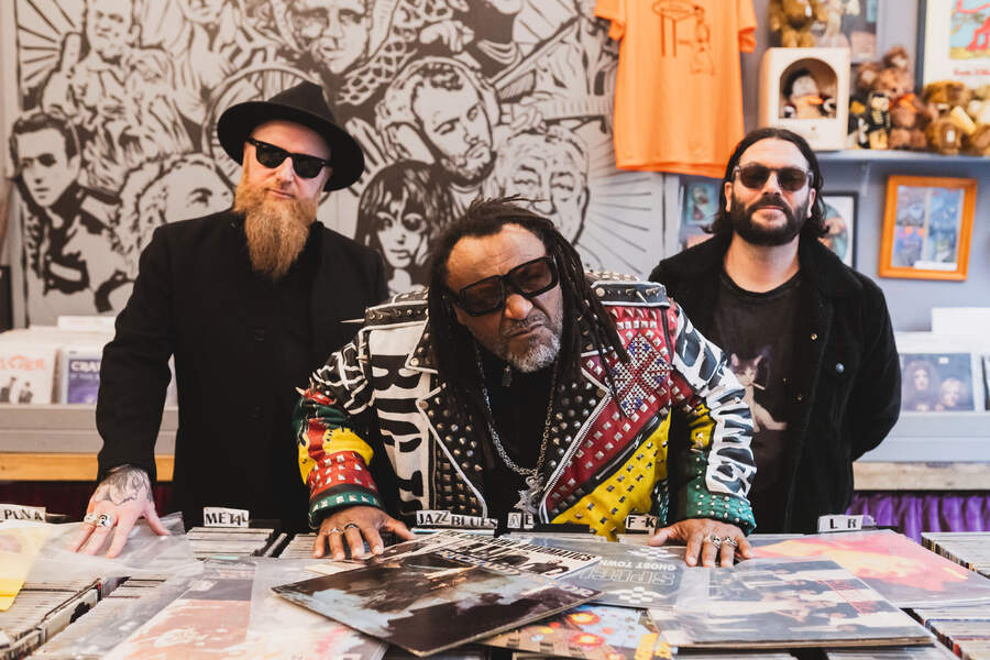 Skindred behind the counter at Kriminal Records