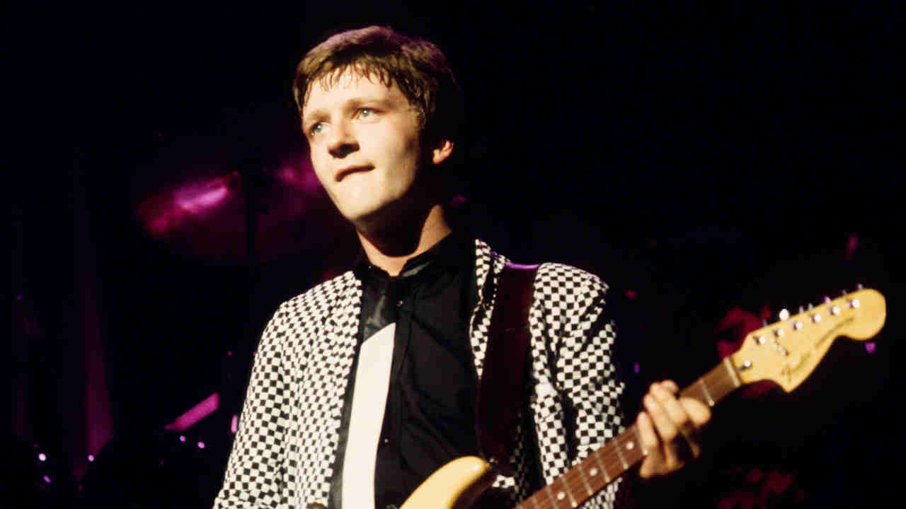 Squeeze&amp;rsquo;s Glen Tillbrook performing onstage in the 1980s