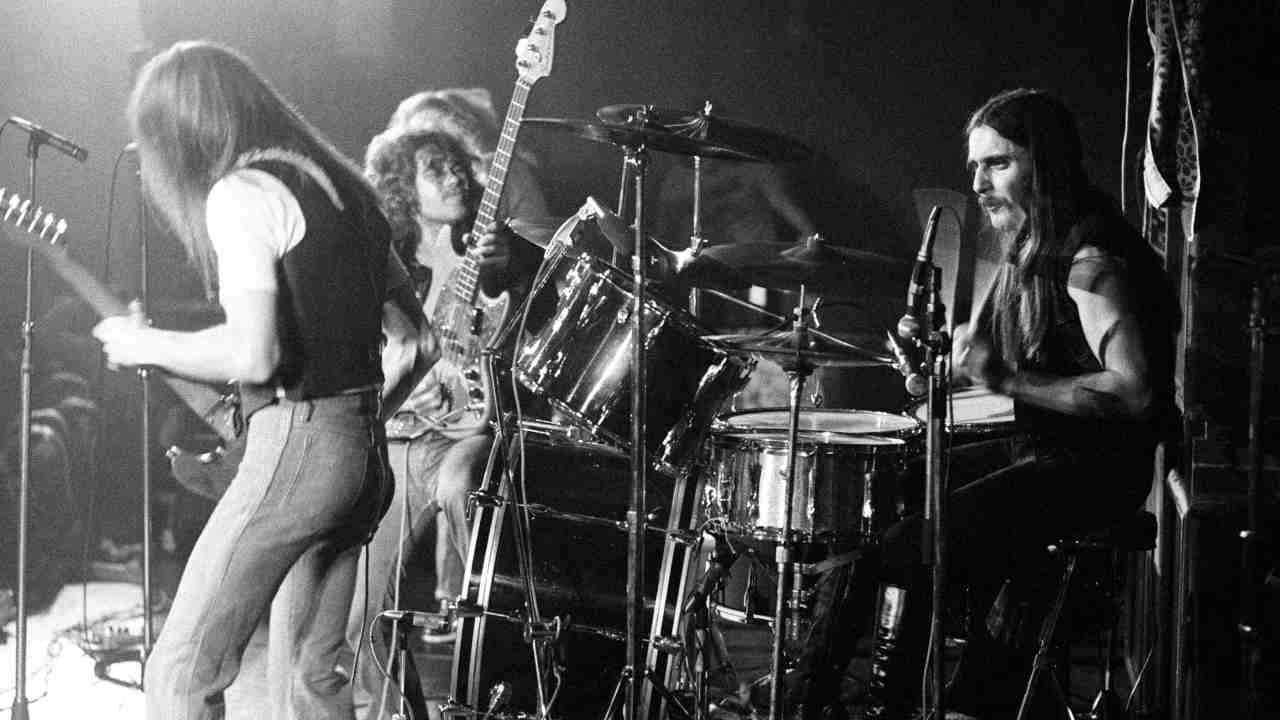 Status Quo performing onstage in the 1970s