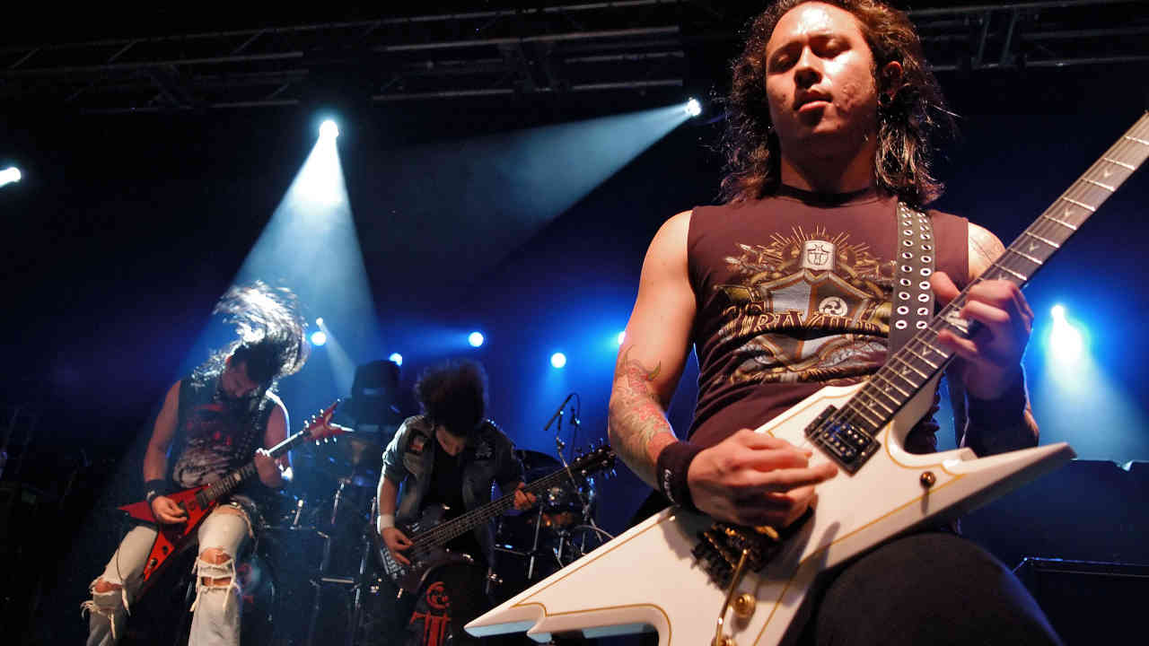 “I don’t think the underground or extreme metal scene will ever dig us. It’s elitist”: How Trivium defied the gatekeepers and split the critics with The Crusade 6 performing onstage in 2006