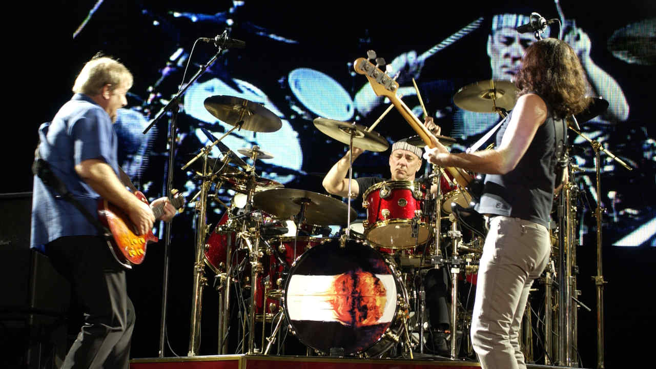 "I believed we would not get back together. I thought Rush was a place Neil was not going to be able to go back to emotionally": How Rush survived the 1990s and early 2000s 7 Rush onstage in 2002