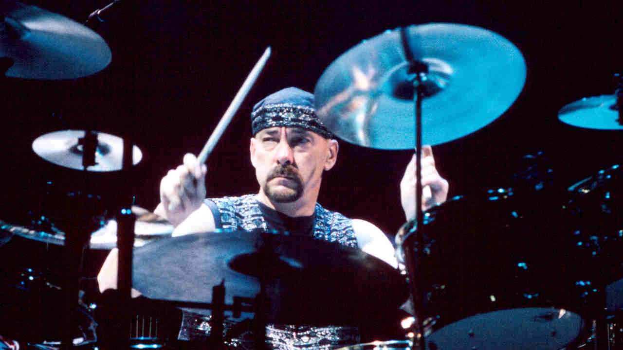 "I believed we would not get back together. I thought Rush was a place Neil was not going to be able to go back to emotionally": How Rush survived the 1990s and early 2000s 9 Rush’s Neil Peart onstage in 1996