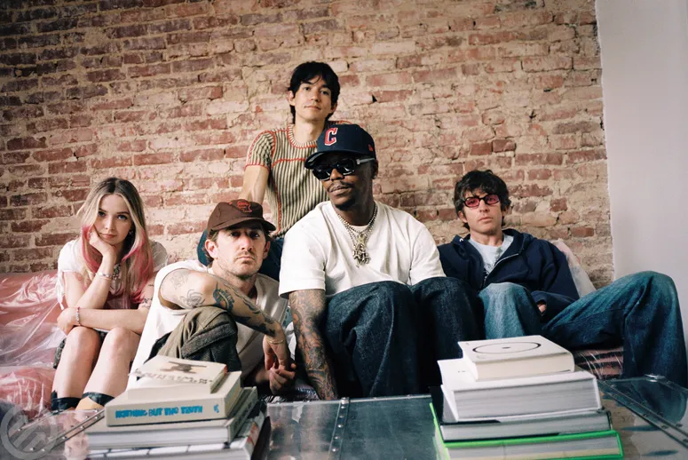 Turnstile Recruit Elton John, Slayyyter, and Panda Bear for Never Enough Remake 3 Image may contain: Lupe Fiasco, Howard Stern, Liam Aiken, People, Person, Clothing, Pants, Teen, Accessories, and Glasses