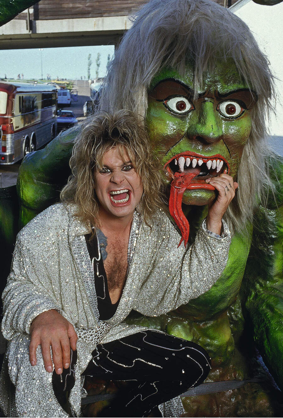 Ozzy poses with a model monster