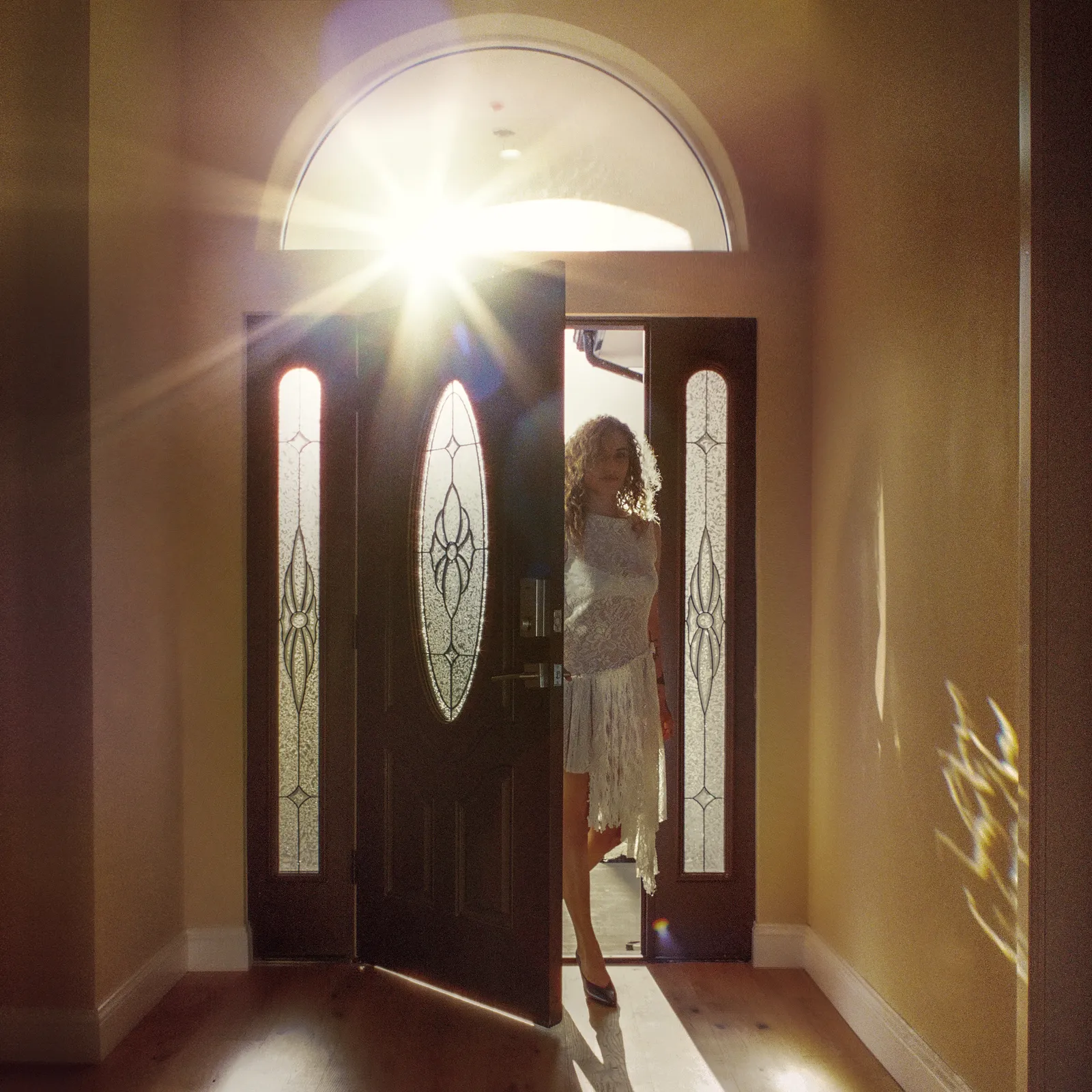Image may contain Door Adult Person Architecture Building Housing Clothing Footwear High Heel Shoe and House