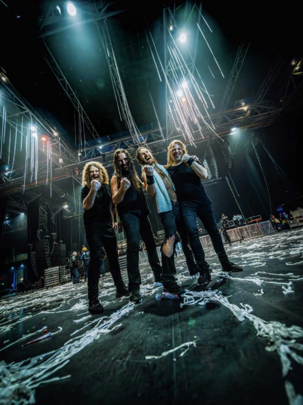 Airbourne standing in an empty arena, post-show