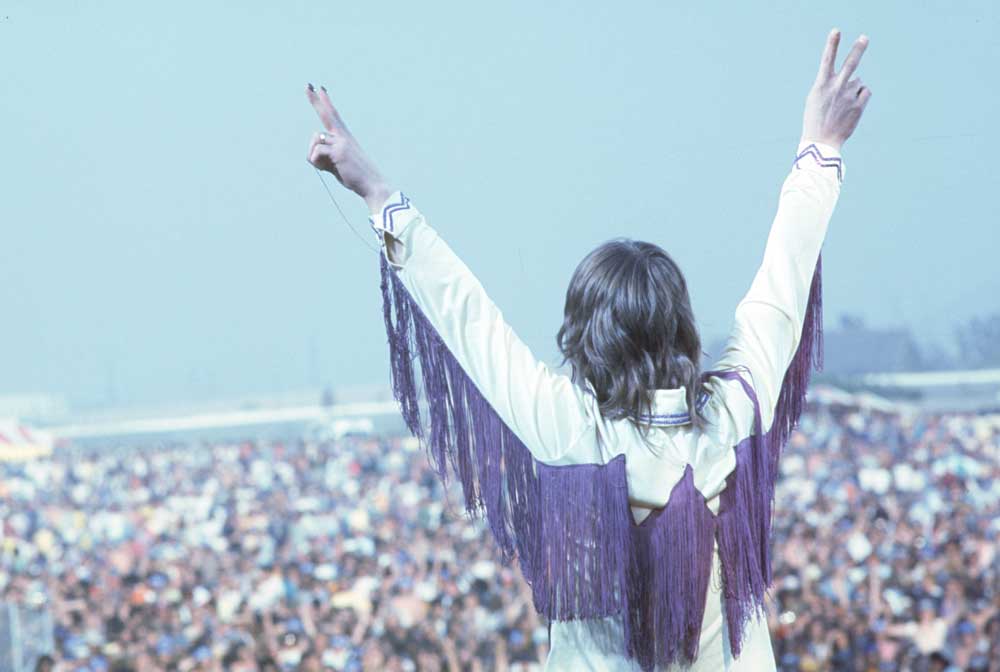 Ozzy Osbourne salutes the crowd at the 1974 California Jam
