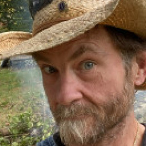 Profile photo of Tim with the hat